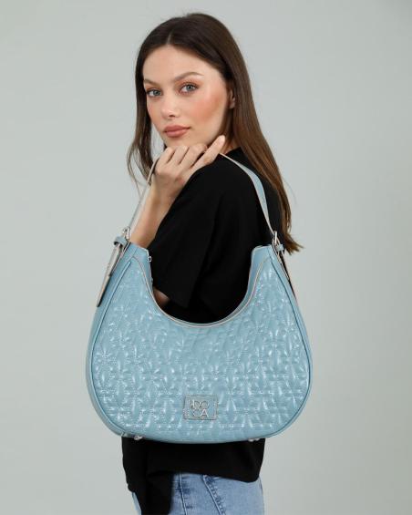 Γυναικεία τσάντα ώμου DOCA σε γαλάζιο χρώμα με ρυθμιζόμενο λουράκι, καπιτονέ υφή και εξωτερική τσέπη. ΤΠΤ074000