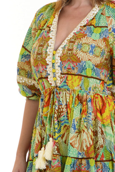 Καλοκαιρινό boho φόρεμα, εμπριμέ με φλοράλ σχέδιο με λεπτομέρεις δαντέλας & μικρές φουντίτσες . 100% βαμβάκι.   Ρ24015000
